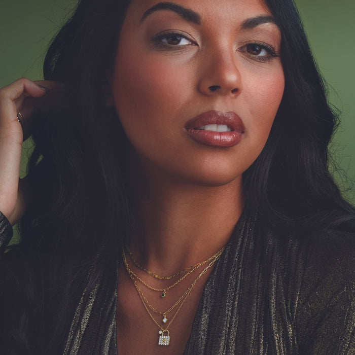 Model wearing Diamond Lock Charm with Gold Chain by Vintage Magnality