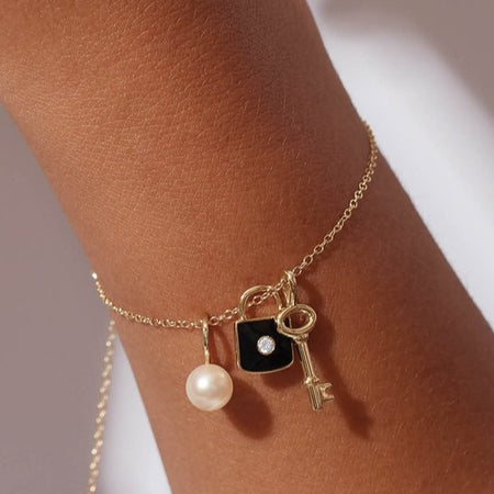 Pearl pendant charm on charm bracelet