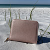 Our Blush Jewelry Travel Case Shown at the beach landscape position