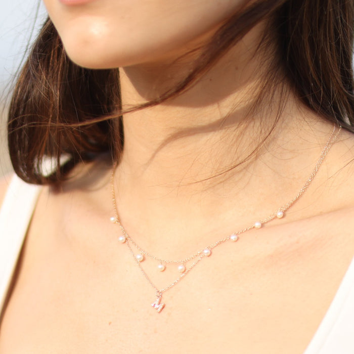 Model wearing freshwater cultured pearl 18" necklace 14K yellow gold 302® Fine Jewelry Storyteller by Vintage Magnality