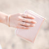 Model holding Cruelty-Free Leatherette Jewelry Travel Case in Blush Storyteller by Vintage Magnality