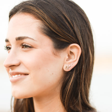 Model wearing Initial Earring in 14K yellow gold 302® Fine Jewelry Storyteller by Vintage Magnality