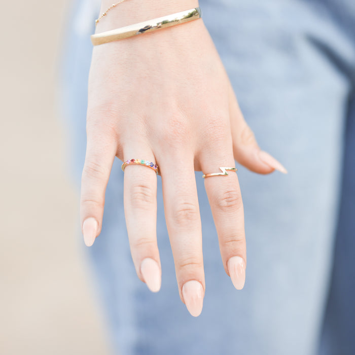 Model wearing half round 6 MM bangle in 14K Yellow Gold Storyteller by Vintage Magnality
