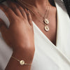 Model wearing Athena and Artemis Coin Necklace and Aphrodite Coin Bracelet