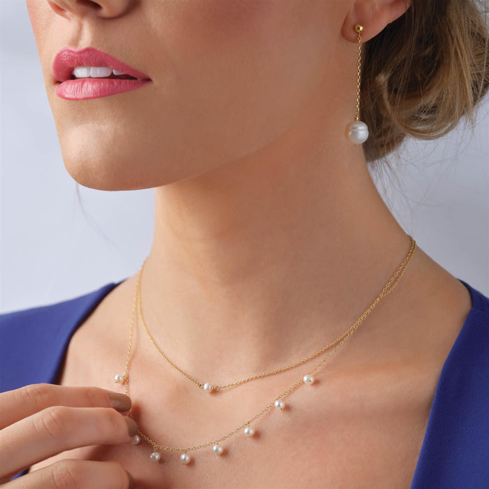 Model wearing our Modern Audrey Freshwater Cultured Pearl 18" Necklace in Solid 14K Yellow Gold 