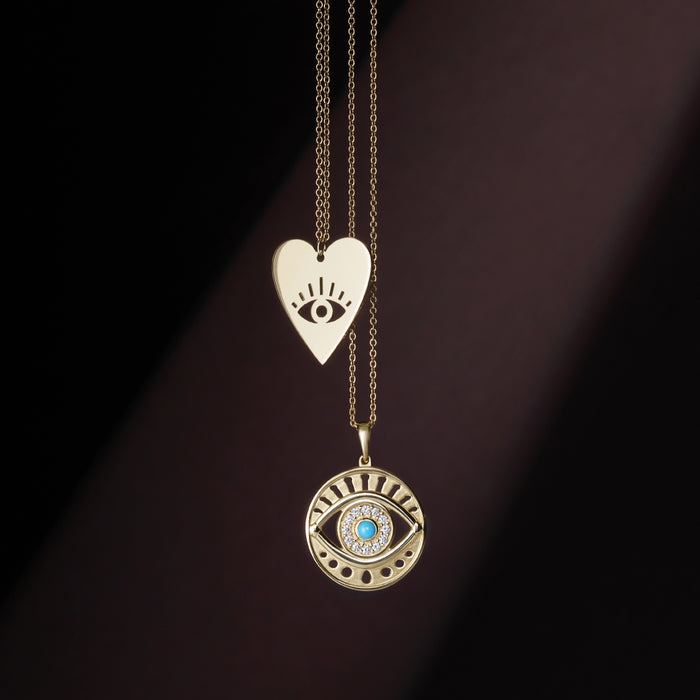 Two Evil Eye Necklaces One in Heart Design and Other Showcasing Natural Turquoise and Diamonds