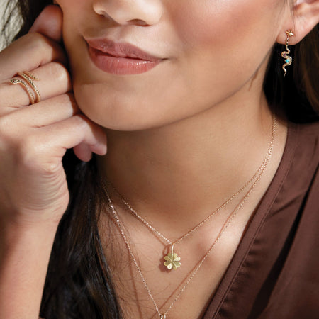 Model Wearing Four Leaf Clover Charm Pendant Necklace in Solid 14K Yellow Gold