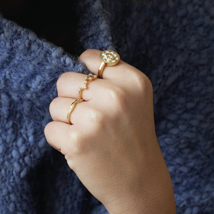 Model wearing Stackable Wear Everyday™ Angel Wings Ring in Solid 14K Yellow Gold