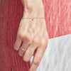 Model wearing Floating Diamond Bracelet and Bezel-Set Diamond Chain Ring