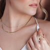 Model Wearing Miraculous Medal White Enamel Solid 14K Yellow Gold Ring with Gold Necklaces