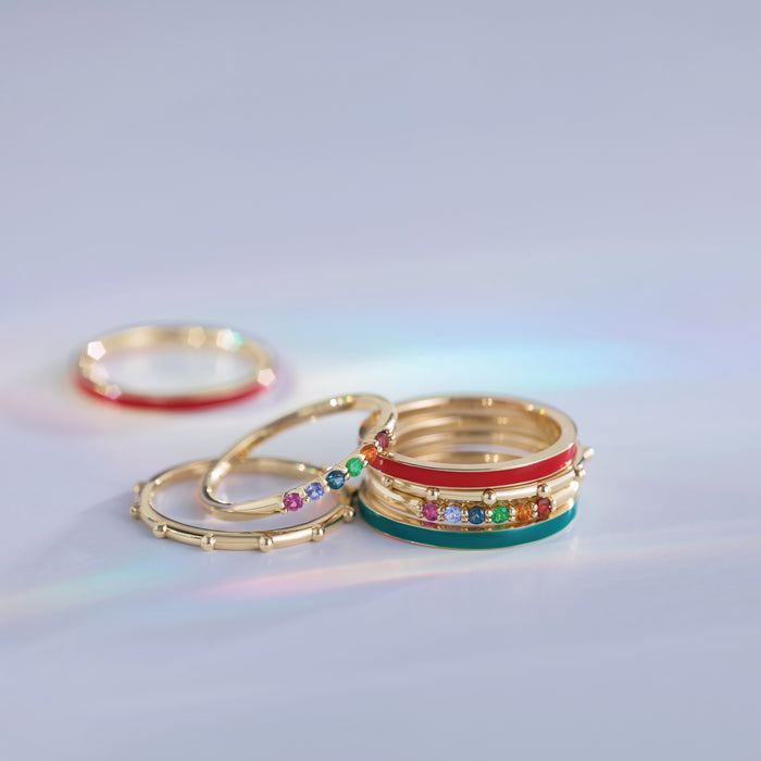 Rainbow Stacking Natural Multi-Gemstone Ring in 14K Yellow Gold Stacked with other gold and enamel rings