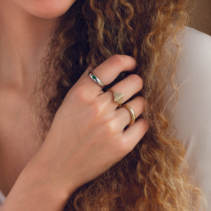 Model wearing our Petite Dome Wear Everyday™ Ring in both Yellow and White 14K Gold