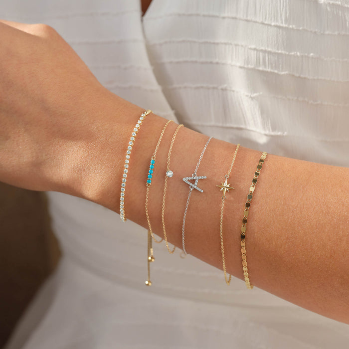 Arm candy diamond and gemstone bracelet stack in 14K gold 