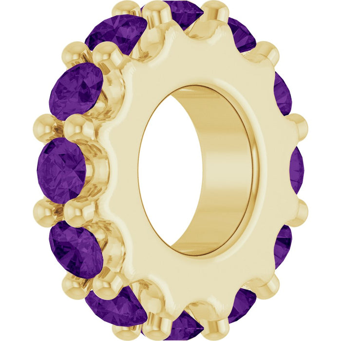 Gold charm with purple gemstones on a white background
