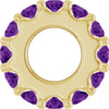 Gold charm with purple gemstones on a white background