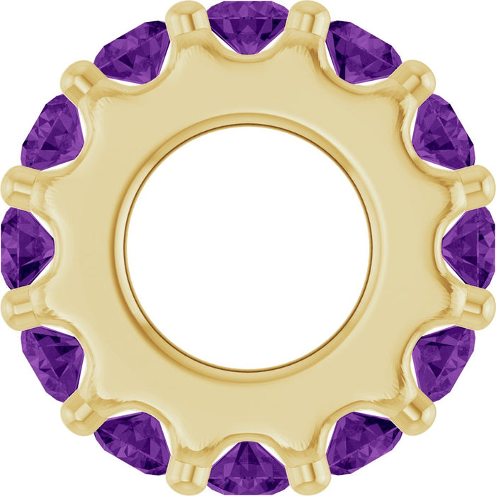Gold charm with purple gemstones on a white background