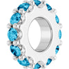 White gold charm with light blue gemstones on a white background