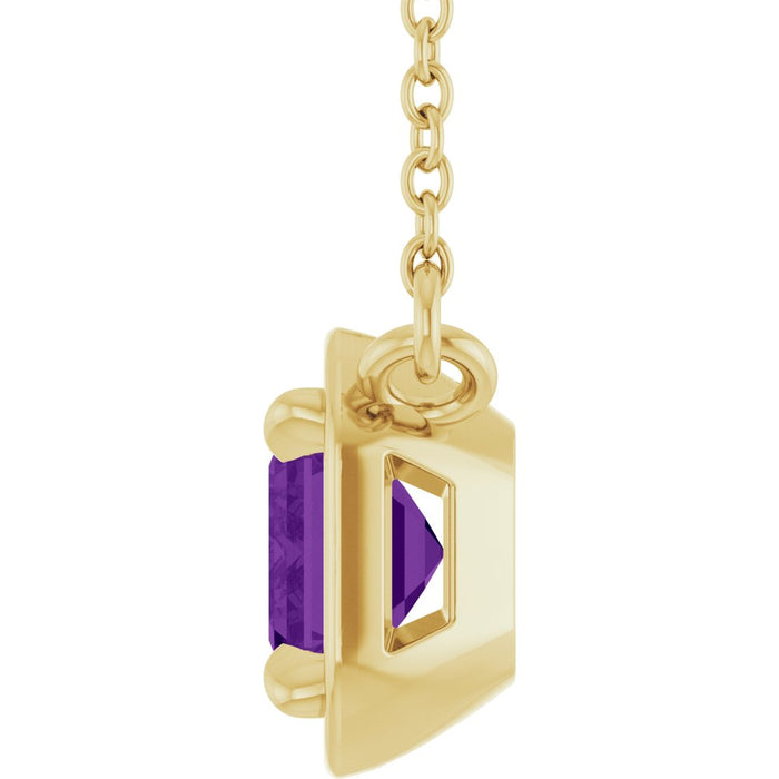 Gold pendant with a purple gemstone on a white background