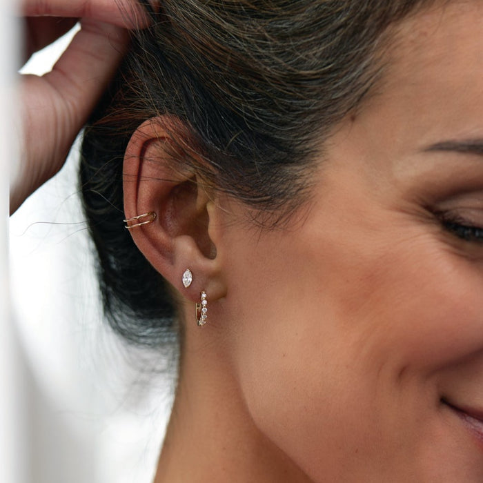 Curated ear featuring our earring cuff with marquise diamond stud earring and diamond hoop