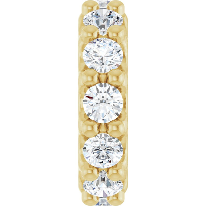 Gold charm with diamond gemstones on a white background