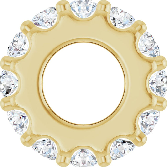 Gold charm with diamond gemstones on a white background