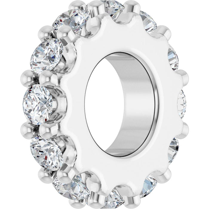 White gold charm with diamond gemstones on a white background