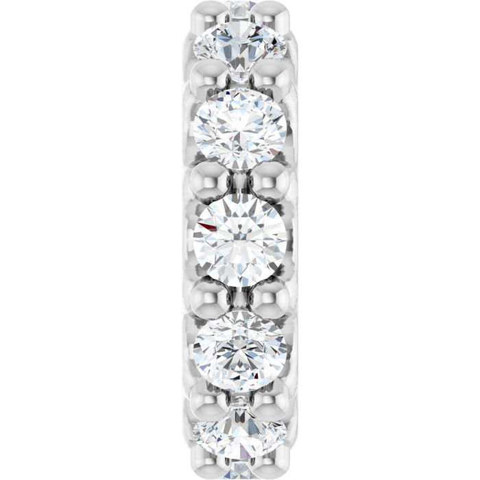 White gold charm with diamond gemstones on a white background