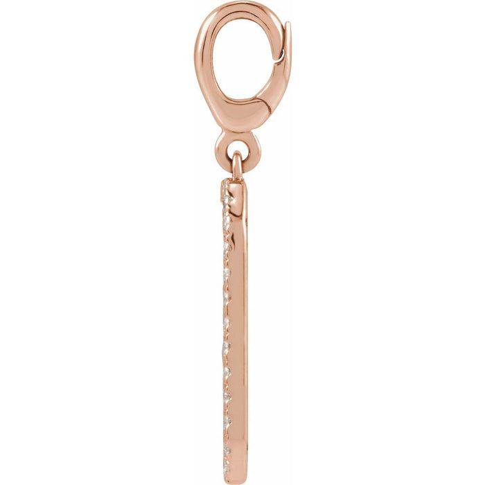 Rose gold dog tag charm with diamonds on a white background