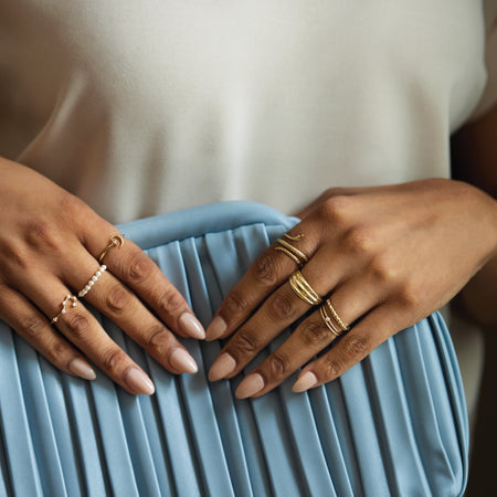 All stacked up with our solid gold rings featuring our Fabulous Modern Freshwater Cultured Pearl Ring