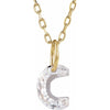 Gold necklace with a floating diamond c initial on a white background