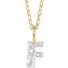 Gold necklace with a floating diamond f initial on a white background