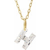 Gold necklace with a floating diamond h initial on a white background
