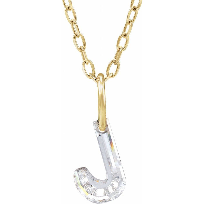 Gold necklace with a floating diamond j initial on a white background