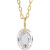 Gold necklace with a floating diamond o initial on a white background