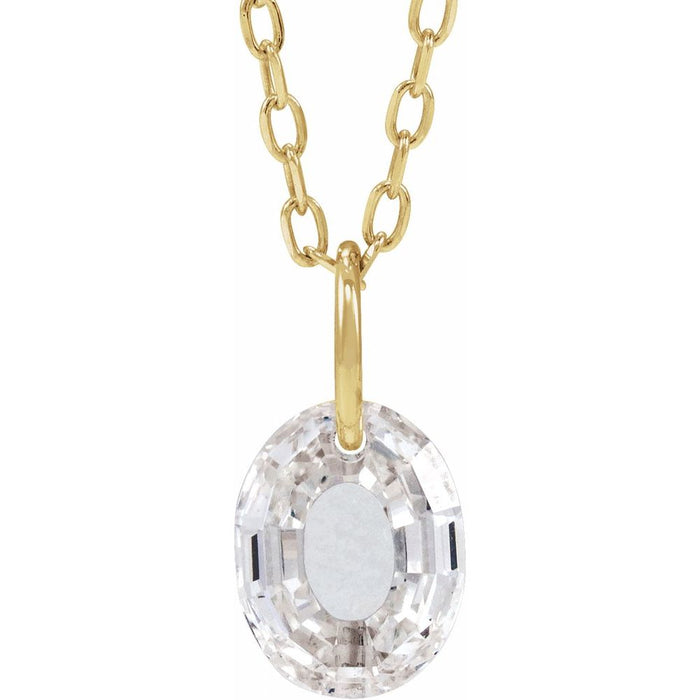 Gold necklace with a floating diamond o initial on a white background