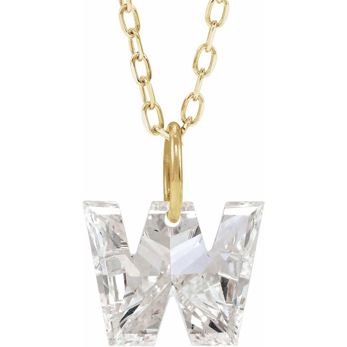 Gold necklace with a floating diamond w initial pendant on a white background