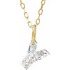 Gold necklace with a floating diamond y initial pendant on a white background