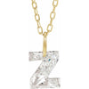 Gold necklace with a floating diamond z initial pendant on a white background