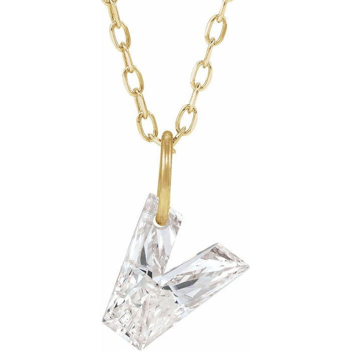 Gold necklace with a floating diamond v initial pendant on a white background