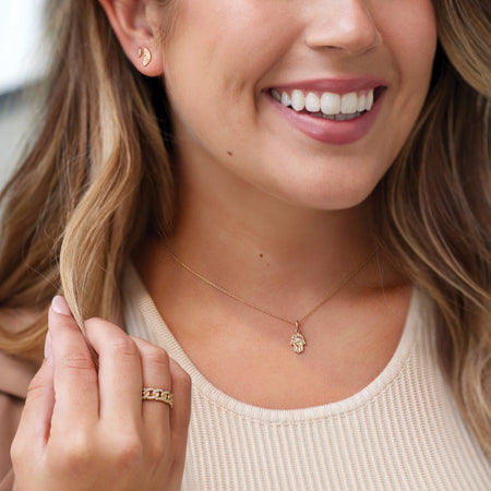 Model wearing our Hamsa Natural Diamond Adjustable Necklace Charm Pendant in Solid 14K gold