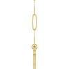 Side view of paperclip yellow gold necklace with a heart shaped bail  on a white background