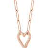 A rose gold paperclip chain necklace featuring a large, open heart-shaped bail pendant suspended from elongated oval links slightly turned on a plain white background.