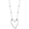 Silver heart-shaped pendant on a paperclip chain slightly turned against a white background
