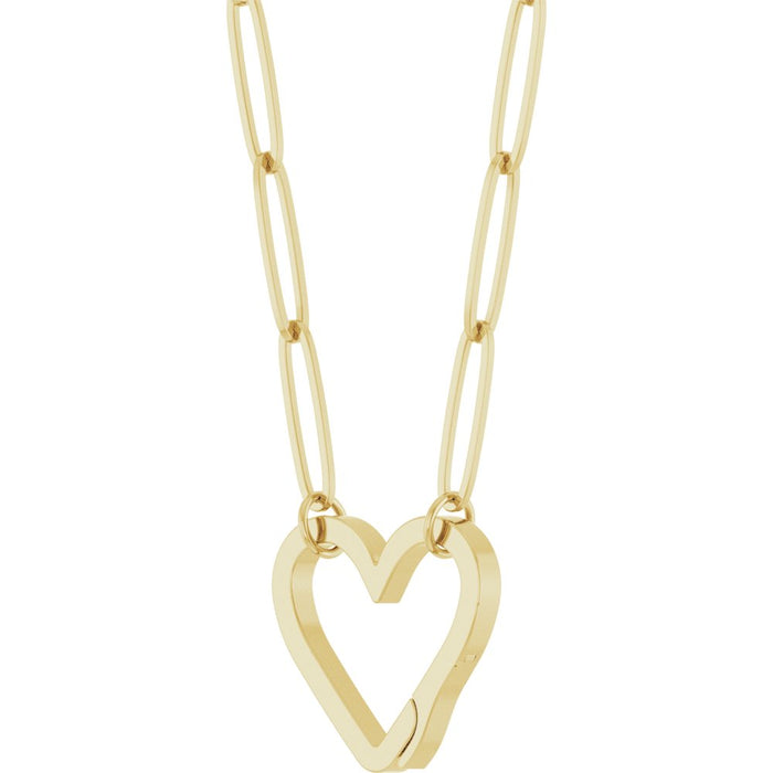 A gold paperclip chain necklace featuring a large, open heart-shaped bail pendant suspended from elongated oval links, slightly turned on a plain white background.