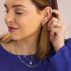 Curated Ear on Model Featuring Geometric Circle Stud Earrings in Solid 14K Yellow Gold 