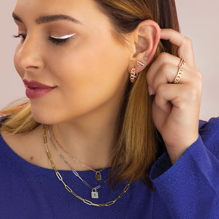 Curated Ear on Model Featuring Geometric Circle Stud Earrings in Solid 14K Yellow Gold 