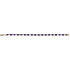 A delicate tennis bracelet featuring oval-cut purple gemstones set in yellow gold, shown horizontally against a plain white background.