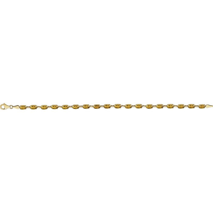 A yellow gold tennis bracelet with oval-cut yellow citrine gemstones, displayed horizontally against a solid white background.