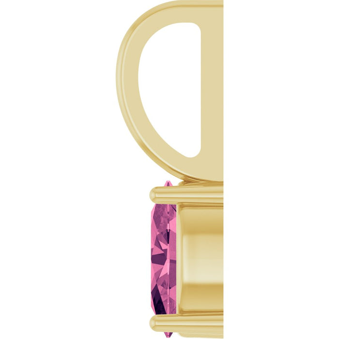 A close-up of a yellow gold pendant setting with a faceted pink tourmaline gemstone, shown against a plain white background.