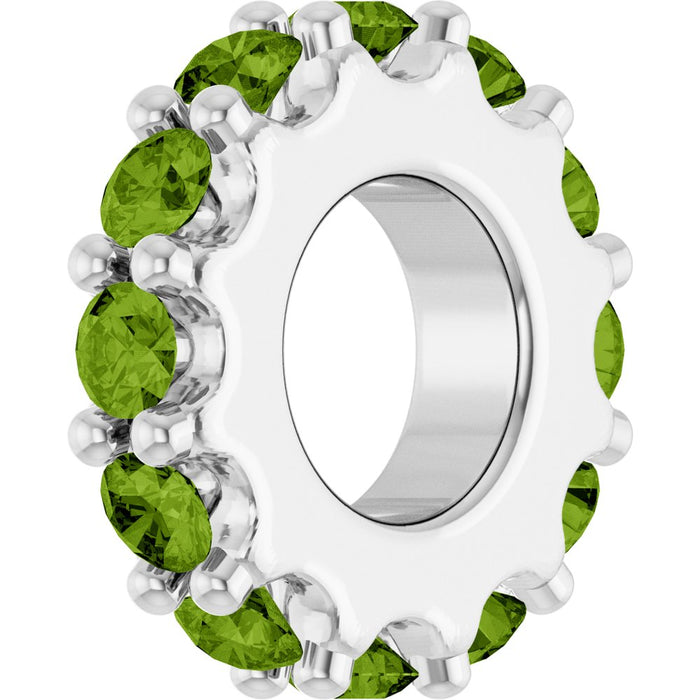 White gold charm with light green gemstones on a white background